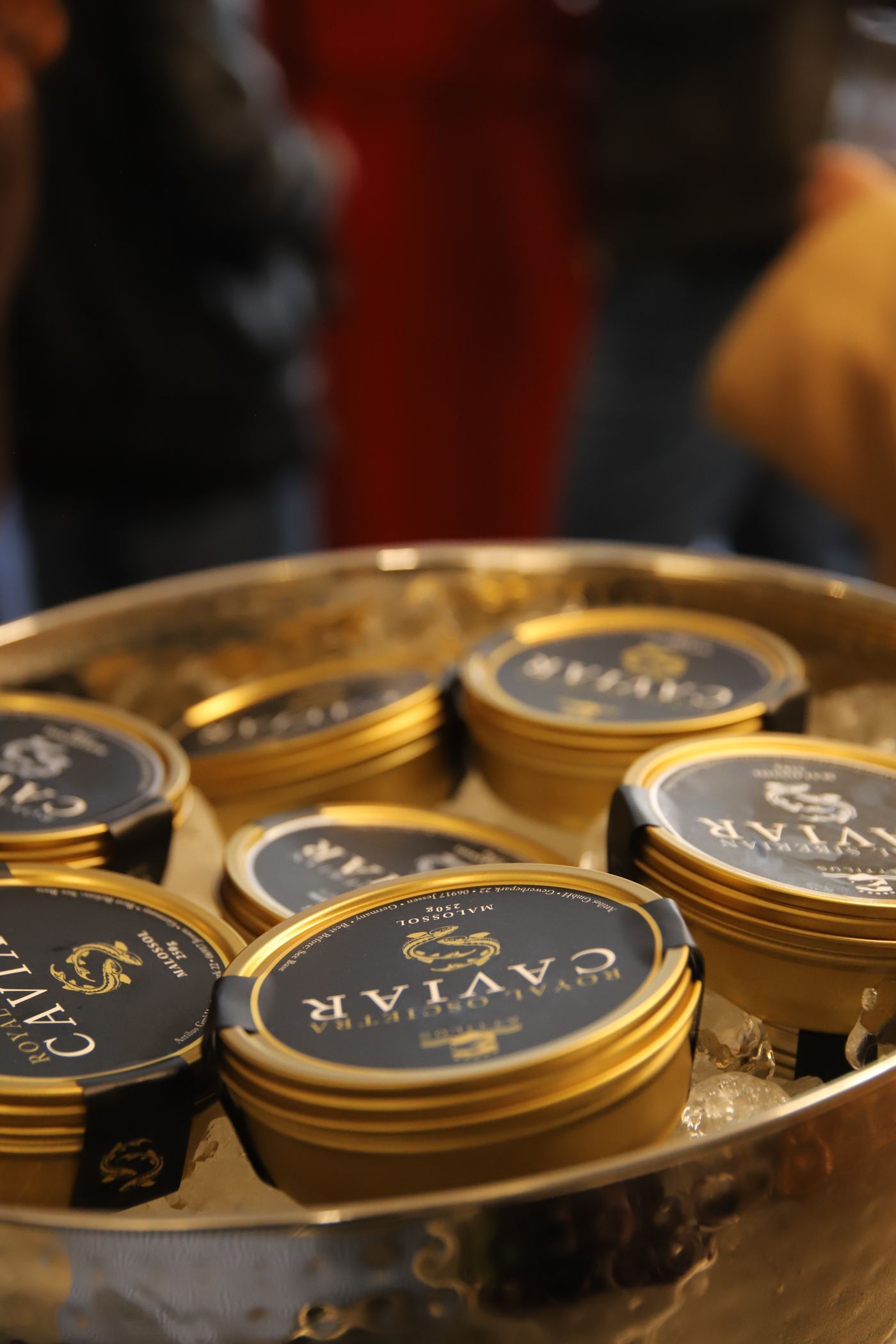 Tins of Attilus caviar on ice, close and warm.