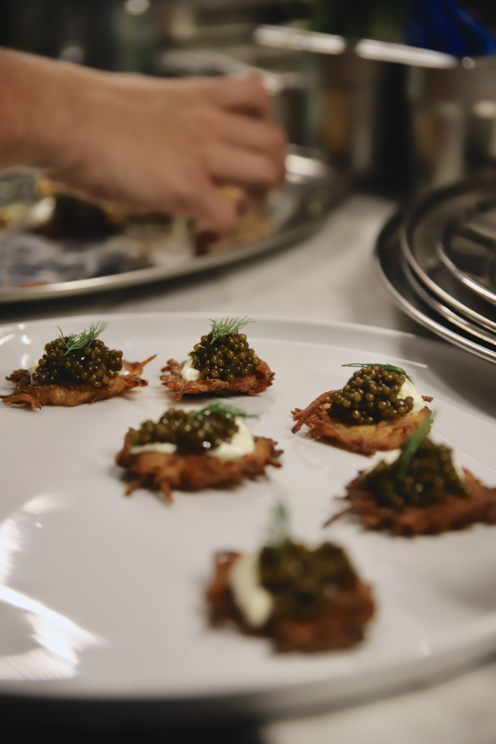 Canapés passed from the kitchen during service.